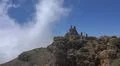 Hiking and heavenly clouds on rocky mountain peak in La Palma island Photo