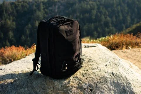 Hiking Backpack Sitting on a Rock Stock Photos