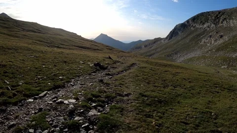 Hiking beautiful path into the mountains Stock Footage 142747689