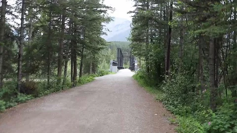 Hiking to a black bridge Stock Footage 112365931