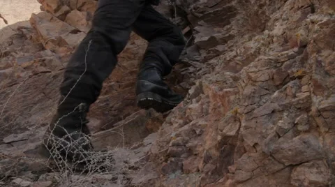 Hiking boot closeup on mountain rocks 스톡 동영상 61146286