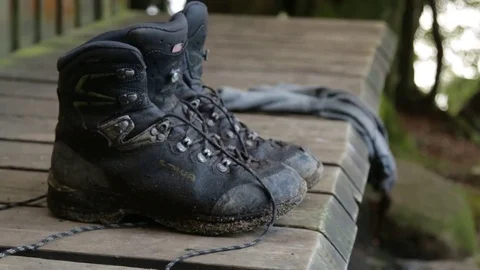 Hiking boots on hut platform Stock Footage 72153711
