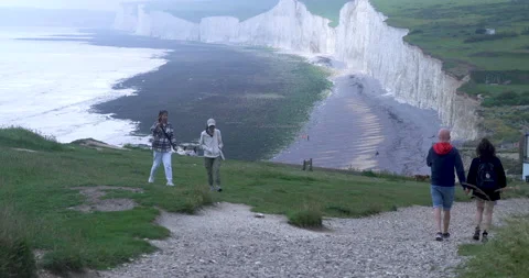 Hiking in the breathtaking scenery of the white cliffs Burling Gap, Eastbourne Stock Footage