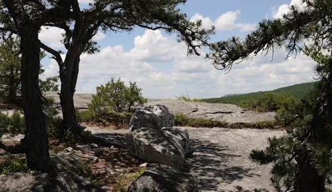 Hiking on a cliff Stock Footage