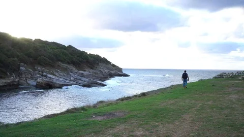 Hiking by the cliff at sunset 스톡 동영상 95977826