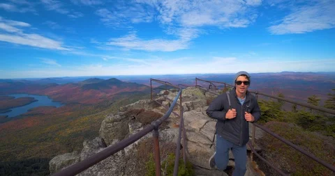 Hiking Couple Exploring Peak of Mountain, Lake Placid NY Stock Footage 102401479