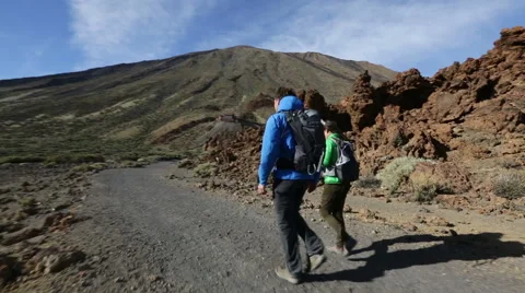 Hiking couple walking volcano Teide on Tenerife - active lifestyle hikers Stock Footage 45572707