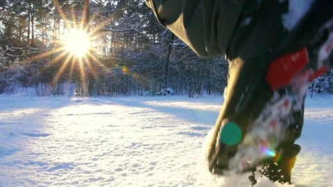 Hiking in the deep snow in winter. Close-up of feet walking . Winter Journey Stock Footage 84949119