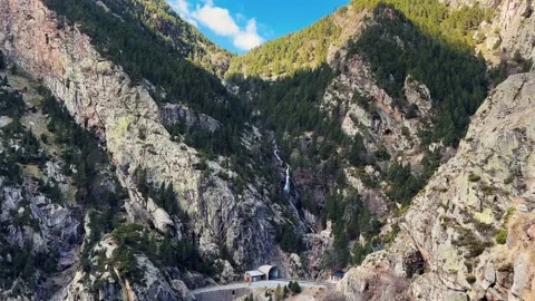 Hiking down the Cremallera de Nuria railway in Vall de Nuria, Pyrenees, Girona,  Stock Footage 237992460
