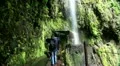 Hiking girl at waterfall passage 20110429 152455 HD Footage
