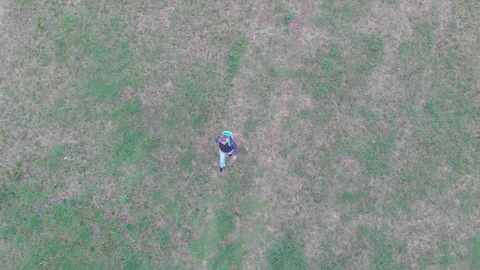 Hiking in green nature environment at springtime. Aerial  view video. Stock Footage 106529180
