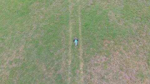 Hiking in green nature environment at springtime. Aerial  view video. Stock Footage 106533296