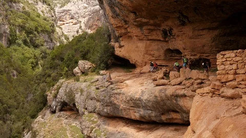 Hiking group walking though a Canyon Stock Footage 98301490