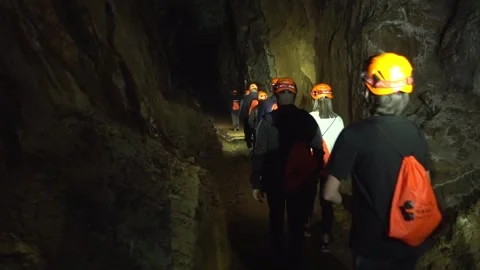 Hiking Group Walking Through Gallery of an Old Abandoned Mine  - 29 Stock Footage 308401546