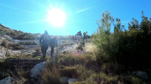 Hiking group walking through path in mountain top against beautiful landscape Video stock 146363802