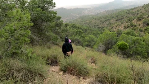 Hiking group walking through path in mountain top against beautiful landscape 動画素材 151264200