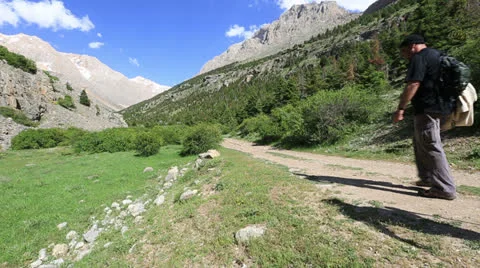 Hiking group walking through valley 4 Stock Footage 24230010