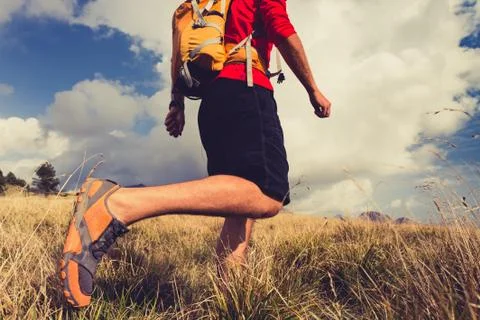 Hiking man with backpack in mountains Foto stock