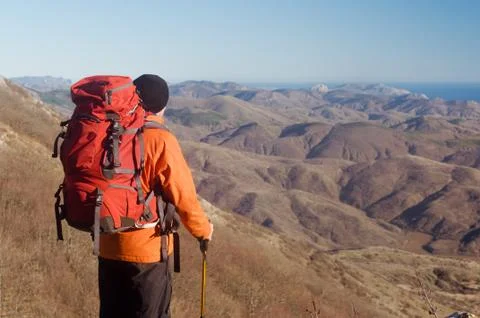 Hiking man with backpack Stock Photos
