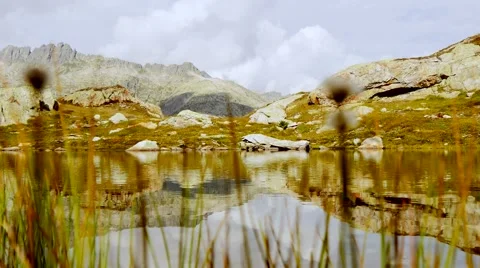 Hiking man walking  alone in mountain landscape scenery Stock Footage 64799810
