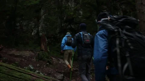 Hiking up a mountain on a cloudy day Stock Footage 64843720