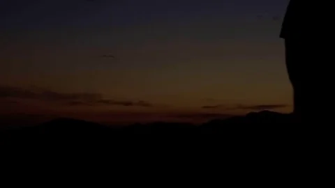 Hiking on the mountain at sunset Stock Footage 77915528