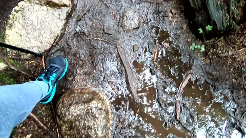 Hiking in a muddy path Point of View 스톡 동영상 143821256