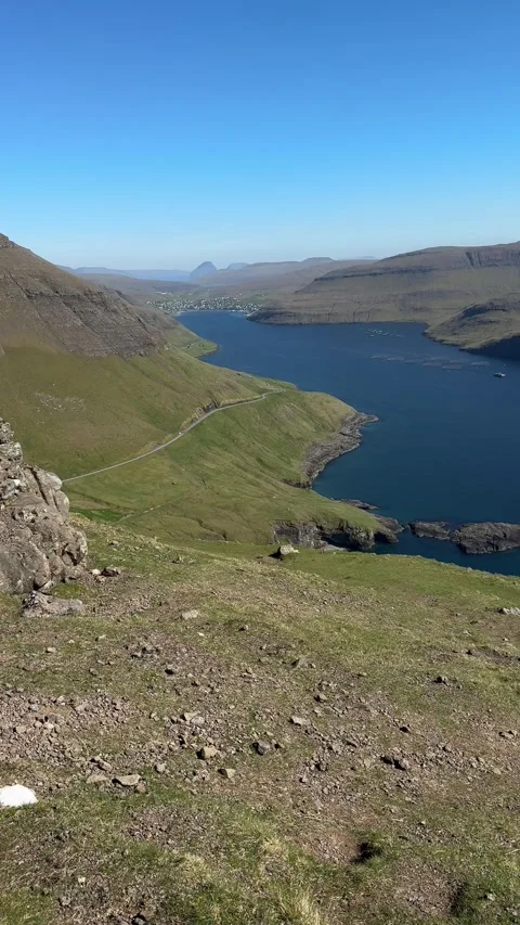 Hiking the Old Postal Route from Bour with views of fjord and mountains, Faroe  Stock Footage 331253222