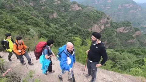 Hiking over a big drop in China Stock Footage 238970969