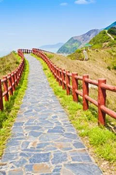 Hiking path and pavillion in mountain ridges Stock Photos