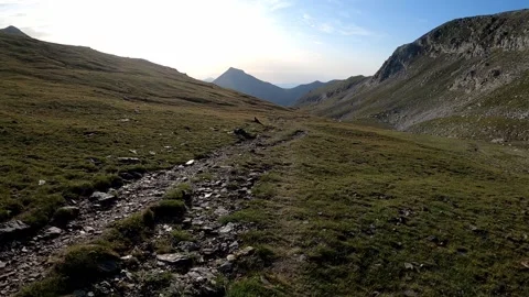 Hiking on a path to the mountain Stock Footage 142747185