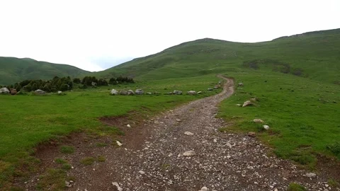 Hiking on a path in the mountains Stock Footage 133285437