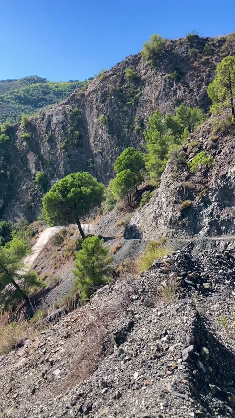 Hiking path to river "Rio Grande" starting from village Yunquera, Andalusia Stock Footage 290047894