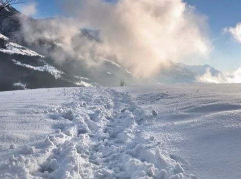 Hiking path in the snow Stock Photos