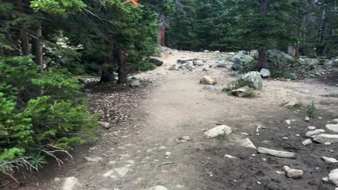 Hiking on straight path with a lil mud Vídeo Stock 204768608