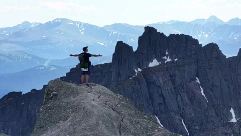 Hiking to the Summit of a Mountain in the Summer Stock Footage 278321090