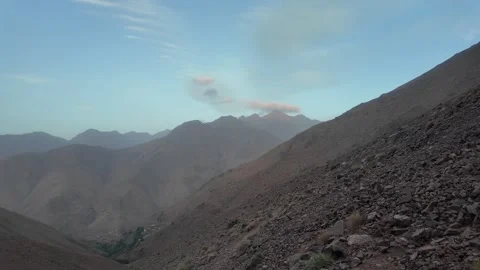 Hiking to the Summit: Reaching Iferouane Peak in Toubkal National Park, Morocco Stock Footage 285870239