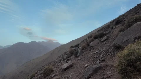 Hiking to the Summit: Reaching Iferouane Peak in Toubkal National Park, Morocco Stock Footage 285870305