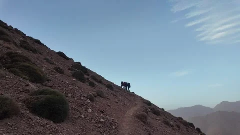 Hiking to the Summit: Reaching Iferouane Peak in Toubkal National Park, Morocco 스톡 동영상 285870417