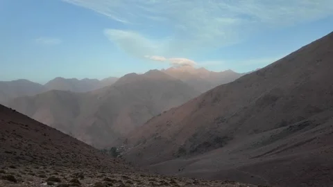 Hiking to the Summit: Reaching Iferouane Peak in Toubkal National Park, Morocco Video stock 285870946