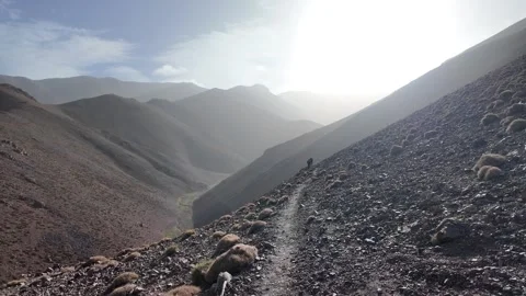 Hiking to the Summit: Reaching Iferouane Peak in Toubkal National Park, Morocco Stock Footage 285871432