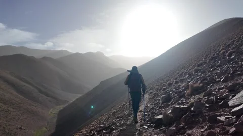 Hiking to the Summit: Reaching Iferouane Peak in Toubkal National Park, Morocco Video stock 285871565