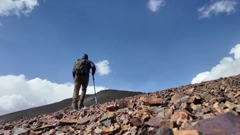 Hiking to the Summit: Reaching Iferouane Peak in Toubkal National Park, Morocco Video stock 285934486