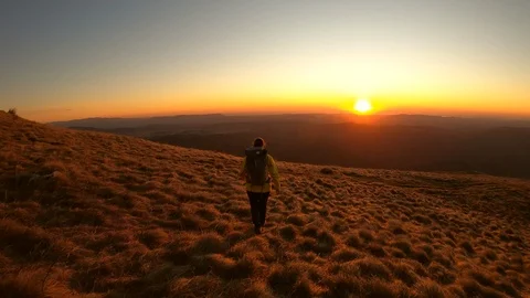 Hiking at sunset on the top of the mountain Stock Footage 126035310