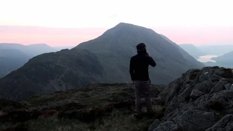 Hiking taking in the view from Haystacks summit Stock Footage 194413555