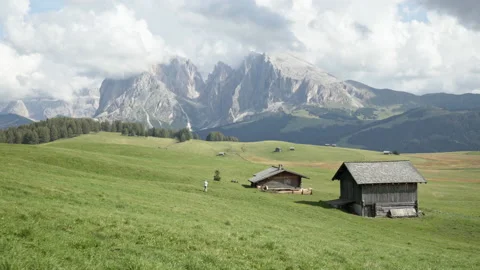 Hiking through alpine landscape of Seiser Alm plateau in the Dolomites Stock Footage 150397571