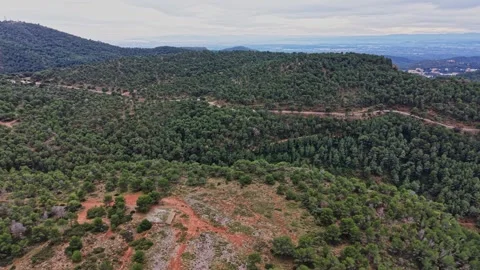Hiking through the forests of Spain with rolling hills and open trails Stock Footage 327641975