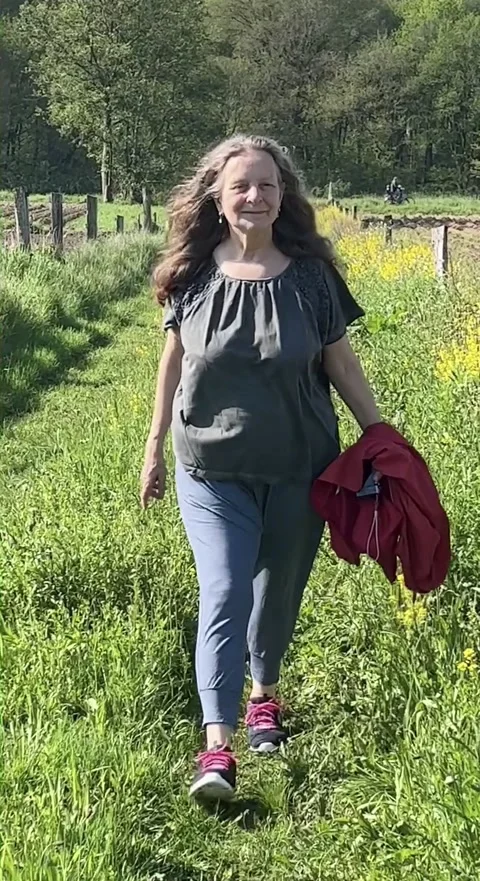 Hiking through the grass Stock Footage 241256368