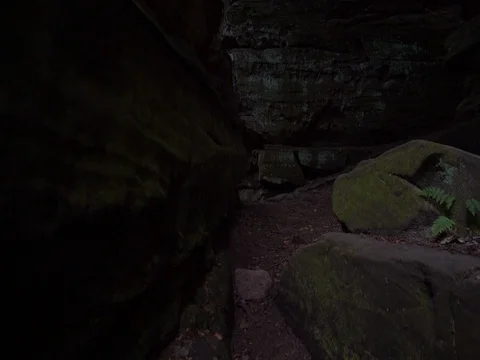 Hiking through large rock formations at Cuyahoga Valley Ledges Stock Footage 82689322