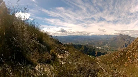 Hiking through the mountain pass while enjoying the view Stock Footage 99117165